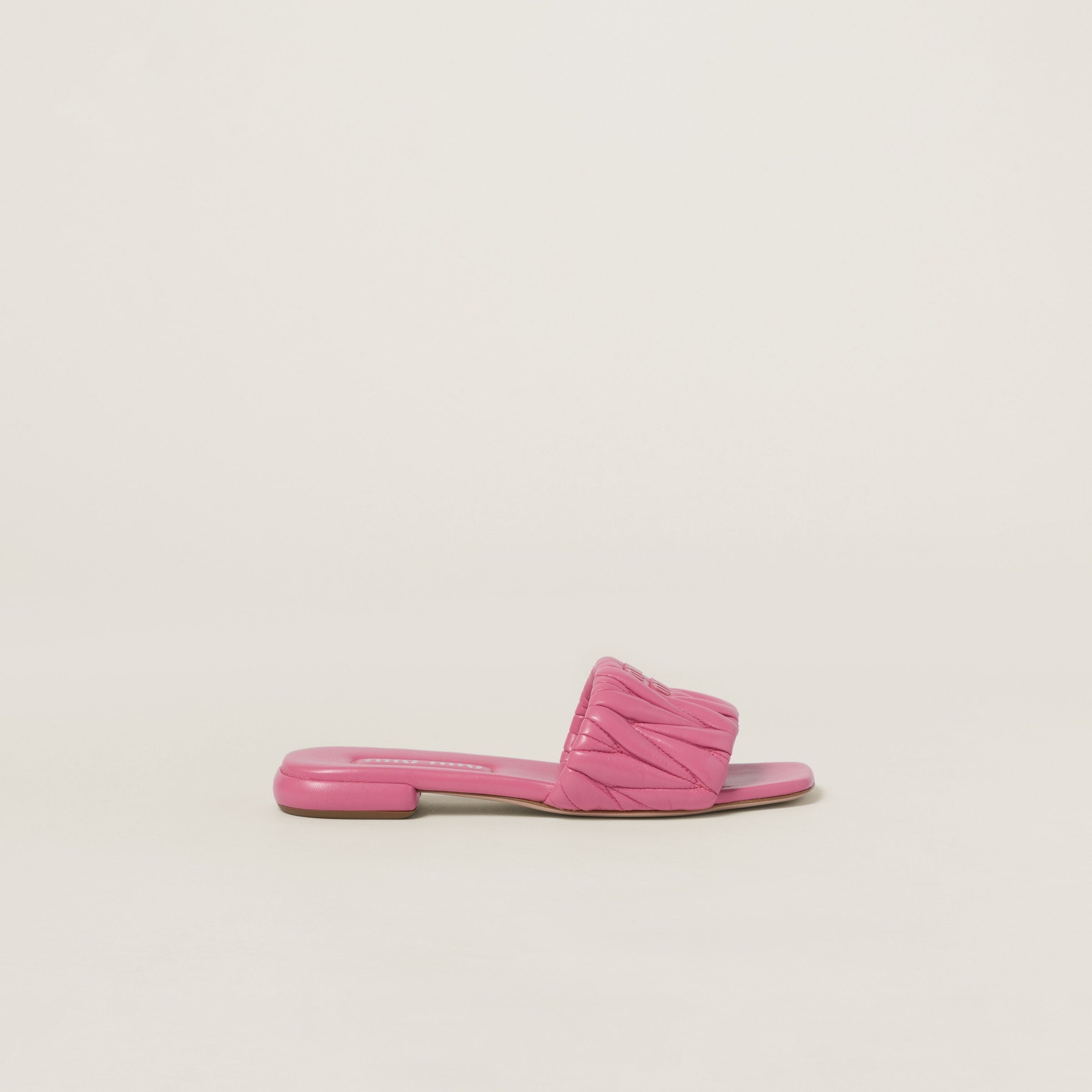 Miu Miu
Matelassé nappa leather slides