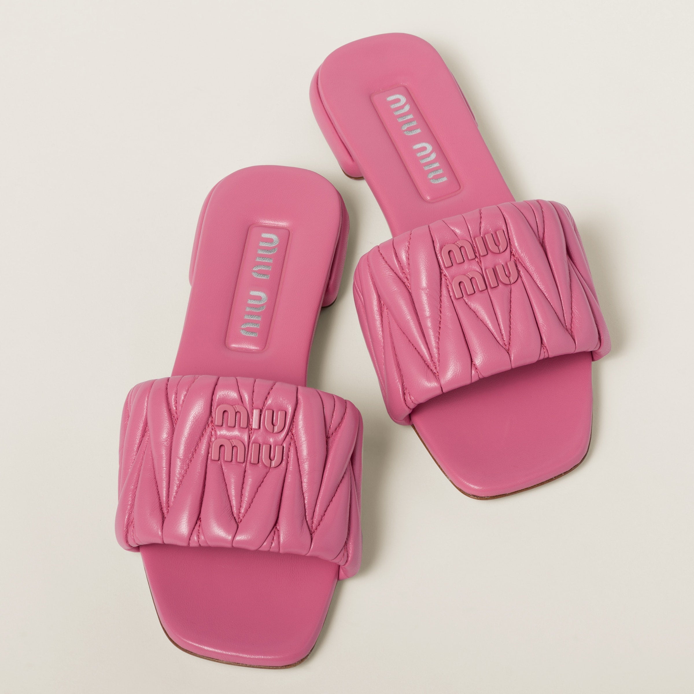 Miu Miu
Matelassé nappa leather slides